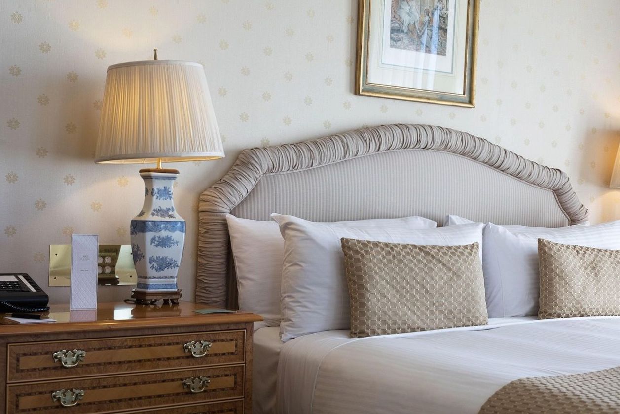 A premium guest room with extra space and soft furnishings